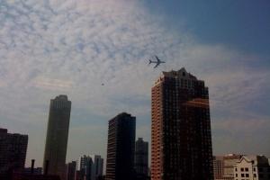 Plane over Manhattan.  Photo is from the Wall Street Journal blog, not property of this blog.